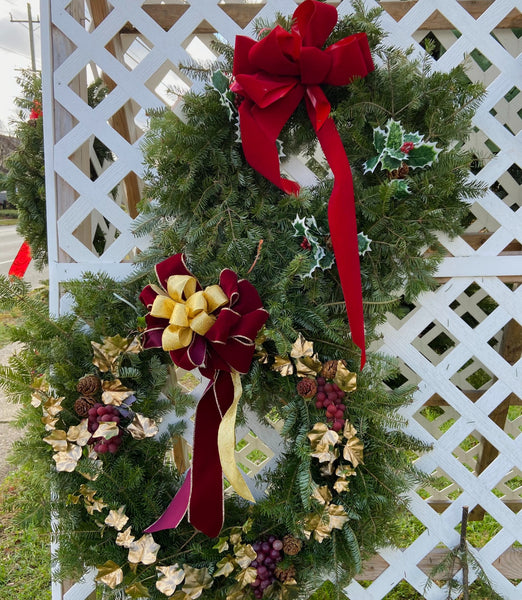 Wreath With Bow, Pinecones, and Holly The Garden of Eden Flower Shop